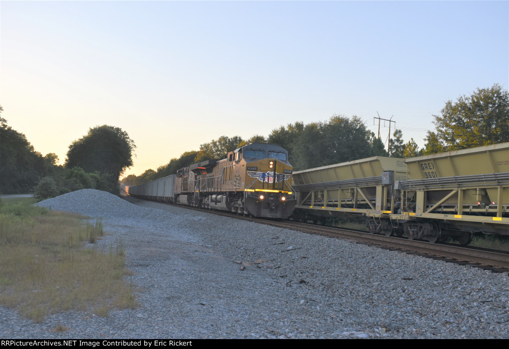 EB Very long NS train passing WB MofW ballast cleaning train